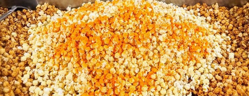 Hand popped caramel coated kettle corn tossed and coated in cheddar cheese